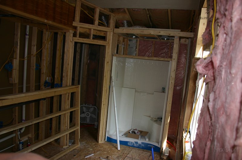 Picture 065.jpg - A one peice shower made installation a snap. This had to be brought in through the picture window opening. The linen closet wall is in the floor.